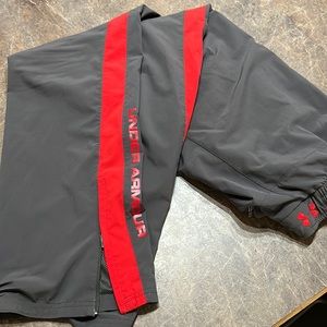 Under Armour size large wind sweat pants. Grey and red